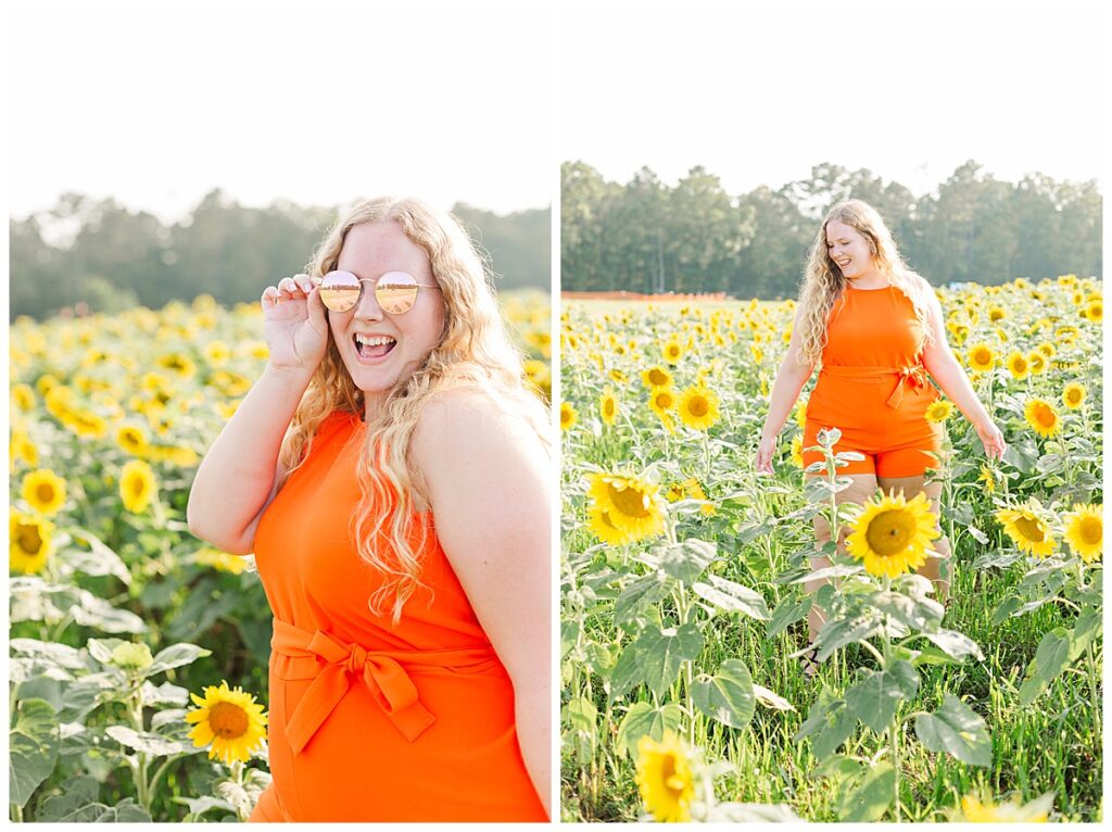 A woman in orange in a sunflower field.