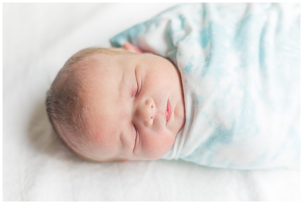 A newborn baby swaddled. Richmond Virginia Newborn Photographer.